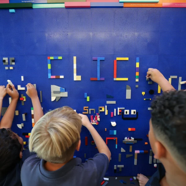 Students build and create together on the CLIC Lego Wall at Curtis School’s Collaborative Learning & Innovation Center in California.